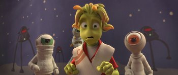 Movie still from “Planet 51” (2009), directed by Javier Abad – An animated character is looking at the camera; Medium shot, Over the shoulder angle