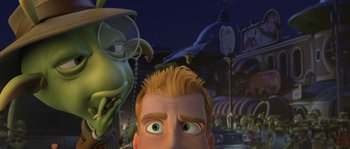 Movie still from “Planet 51” (2009), directed by Javier Abad – A man and a woman are looking into the camera; Close Up shot, Over the shoulder angle