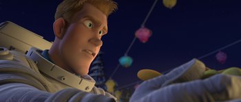 Movie still from “Planet 51” (2009), directed by Javier Abad – A person's face in front of a string of lights; Medium shot, Low angle
