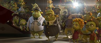 Movie still from “Planet 51” (2009), directed by Javier Abad – A group of people that are standing in a room; Wide shot, Low angle
