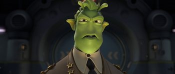 Movie still from “Planet 51” (2009), directed by Javier Abad – An image of a man with a green face; Close Up shot, Low angle