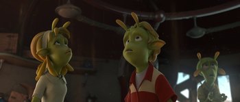 Movie still from “Planet 51” (2009), directed by Javier Abad – A cartoon of a green creature looking sad; Medium shot, High angle