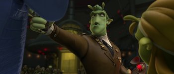 Movie still from “Planet 51” (2009), directed by Javier Abad – A man in a suit and tie holding something in his hand; Medium shot, Over the shoulder angle