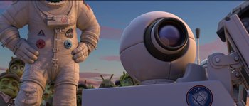 Movie still from “Planet 51” (2009), directed by Javier Abad – An animated scene of a person in a spaceman suit; Wide shot, Low angle