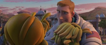Movie still from “Planet 51” (2009), directed by Javier Abad – An animated man holding a bunch of bananas in his hands; Medium shot, Over the shoulder angle