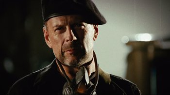 Movie still from “Planet Terror” (2007), directed by Robert Rodriguez – A person wearing a hat; Close Up shot, Low angle