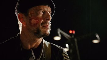 Movie still from “Planet Terror” (2007), directed by Robert Rodriguez – A person wearing a hat; Close Up shot, Low angle