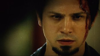 Movie still from “Planet Terror” (2007), directed by Robert Rodriguez – A person with a beard; Close Up shot, Low angle