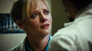 Movie still from “Planet Terror” (2007), directed by Robert Rodriguez – A person looking at something; Close Up shot, Over the shoulder angle