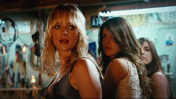 Movie still from “Planet Terror” (2007), directed by Robert Rodriguez – Two women standing next to each other in front of a mirror; Close Up shot, Low angle