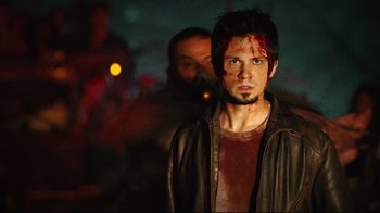 Movie still from “Planet Terror” (2007), directed by Robert Rodriguez – A man with blood all over his face; Close Up shot, Low angle