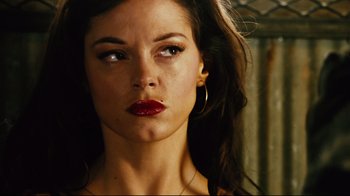 Movie still from “Planet Terror” (2007), directed by Robert Rodriguez – A person wearing a red lipstick; Close Up shot, Low angle