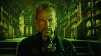 Movie still from “Planet Terror” (2007), directed by Robert Rodriguez – A person wearing a jacket; Close Up shot, Low angle