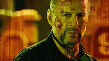 Movie still from “Planet Terror” (2007), directed by Robert Rodriguez – A person with blood all over his face; Close Up shot, Low angle