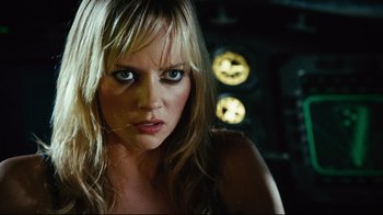 Movie still from “Planet Terror” (2007), directed by Robert Rodriguez – A beautiful blonde woman with blue eyes and long blonde hair; Close Up shot, Low angle