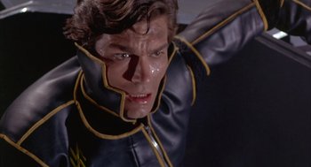 Movie still from “Planet of the Vampires” (1965), directed by Mario Bava – A person wearing a leather jacket; Close Up shot, Low angle