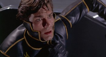 Movie still from “Planet of the Vampires” (1965), directed by Mario Bava – A person wearing a black and yellow costume; Close Up shot, Low angle