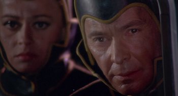 Movie still from “Planet of the Vampires” (1965), directed by Mario Bava – A person wearing a helmet; Close Up shot, Low angle