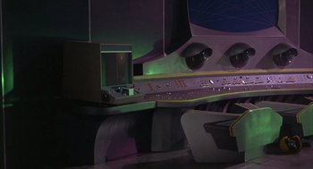 Movie still from “Planet of the Vampires” (1965), directed by Mario Bava – A computer desk with a computer on top of it; Extreme Wide shot, Low angle