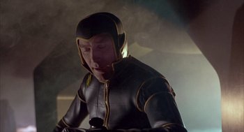 Movie still from “Planet of the Vampires” (1965), directed by Mario Bava – A man wearing a black and yellow costume; Medium shot, Low angle