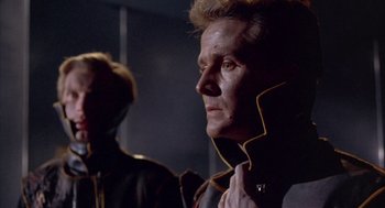 Movie still from “Planet of the Vampires” (1965), directed by Mario Bava – A man in a leather jacket looking at the camera; Close Up shot, Low angle