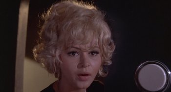 Movie still from “Planet of the Vampires” (1965), directed by Mario Bava – A person with blonde hair; Close Up shot, Low angle