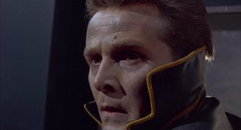 Movie still from “Planet of the Vampires” (1965), directed by Mario Bava – A person wearing a mask; Close Up shot, Over the shoulder angle