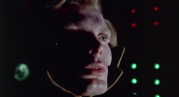 Movie still from “Planet of the Vampires” (1965), directed by Mario Bava – A person's face in the dark; Close Up shot, Low angle