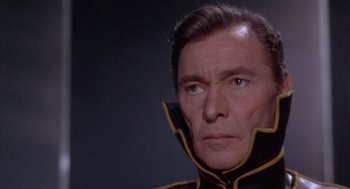 Movie still from “Planet of the Vampires” (1965), directed by Mario Bava – A person wearing a uniform; Close Up shot, Low angle