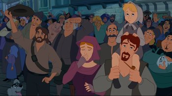 Movie still from “Pocahontas” (1995), directed by Mike Gabriel – A group of people standing around in a crowd; Wide shot, Over the shoulder angle