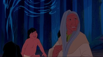 Movie still from “Pocahontas” (1995), directed by Mike Gabriel – An old woman and a young girl in a forest; Medium shot, Over the shoulder angle