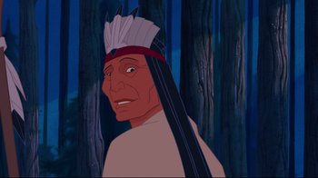 Movie still from “Pocahontas” (1995), directed by Mike Gabriel – An animated picture of an indian in the woods; Close Up shot, Over the shoulder angle