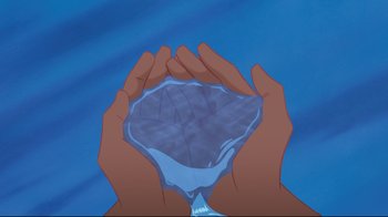 Movie still from “Pocahontas” (1995), directed by Mike Gabriel – Two hands are holding a glass of water in front of a blue background; Extreme Close Up shot, High angle