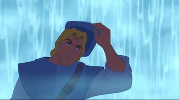 Movie still from “Pocahontas” (1995), directed by Mike Gabriel – A man in a blue shirt and a blue hat is holding his hand up to his head; Close Up shot, Over the shoulder angle