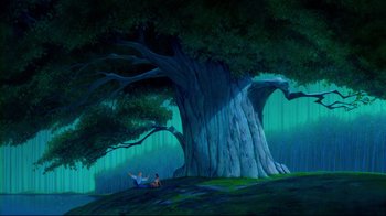 Movie still from “Pocahontas” (1995), directed by Mike Gabriel – Two people sitting under a large tree in the middle of a forest; Extreme Wide shot, High angle