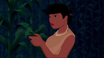 Movie still from “Pocahontas” (1995), directed by Mike Gabriel – An animated woman is pointing to a plant; Close Up shot, Over the shoulder angle