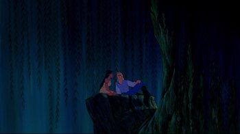 Movie still from “Pocahontas” (1995), directed by Mike Gabriel – A man and a woman sitting on top of a rock; Wide shot, Over the shoulder angle