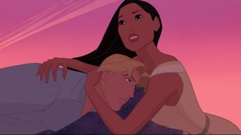 Movie still from “Pocahontas” (1995), directed by Mike Gabriel – A man and a woman hugging in front of a pink sky; Close Up shot, High angle