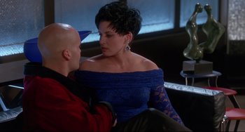 Movie still from “Poetic Justice” (1993), directed by John Singleton – A man and a woman sitting on a couch; Medium shot, Over the shoulder angle