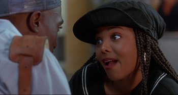 Movie still from “Poetic Justice” (1993), directed by John Singleton – A young girl wearing a black hat talking to an older man; Close Up shot, Over the shoulder angle