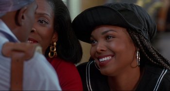 Movie still from “Poetic Justice” (1993), directed by John Singleton – Two young women smiling for the camera; Close Up shot, Over the shoulder angle