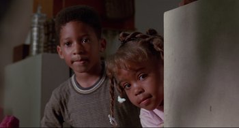 Movie still from “Poetic Justice” (1993), directed by John Singleton – Two young children standing next to each other in a room; Close Up shot, Low angle
