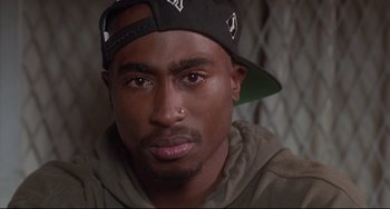 Movie still from “Poetic Justice” (1993), directed by John Singleton – A person wearing a hat; Close Up shot, Over the shoulder angle