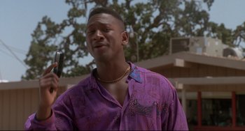 Movie still from “Poetic Justice” (1993), directed by John Singleton – A person wearing a purple shirt; Close Up shot, Low angle