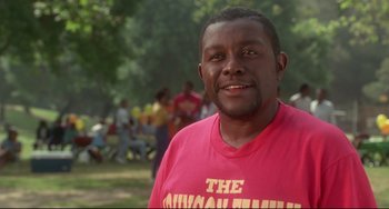 Movie still from “Poetic Justice” (1993), directed by John Singleton – A person wearing a pink t - shirt; Close Up shot, Low angle
