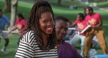 Movie still from “Poetic Justice” (1993), directed by John Singleton – A woman and a man smile for the camera; Close Up shot, Low angle