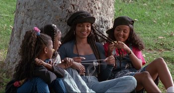 Movie still from “Poetic Justice” (1993), directed by John Singleton – A group of young women sitting next to each other; Medium shot, High angle