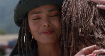 Movie still from “Poetic Justice” (1993), directed by John Singleton – A person with their eyes closed; Close Up shot, Over the shoulder angle