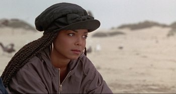 Movie still from “Poetic Justice” (1993), directed by John Singleton – A person wearing a hat and a jacket; Close Up shot, Over the shoulder angle