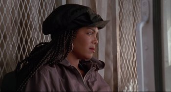 Movie still from “Poetic Justice” (1993), directed by John Singleton – A woman wearing a hat and a jacket; Close Up shot, Over the shoulder angle